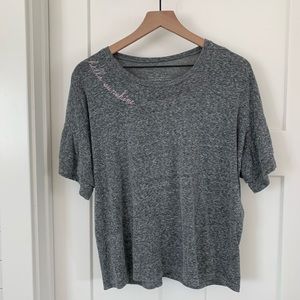 Gray top with pink letter embroidery